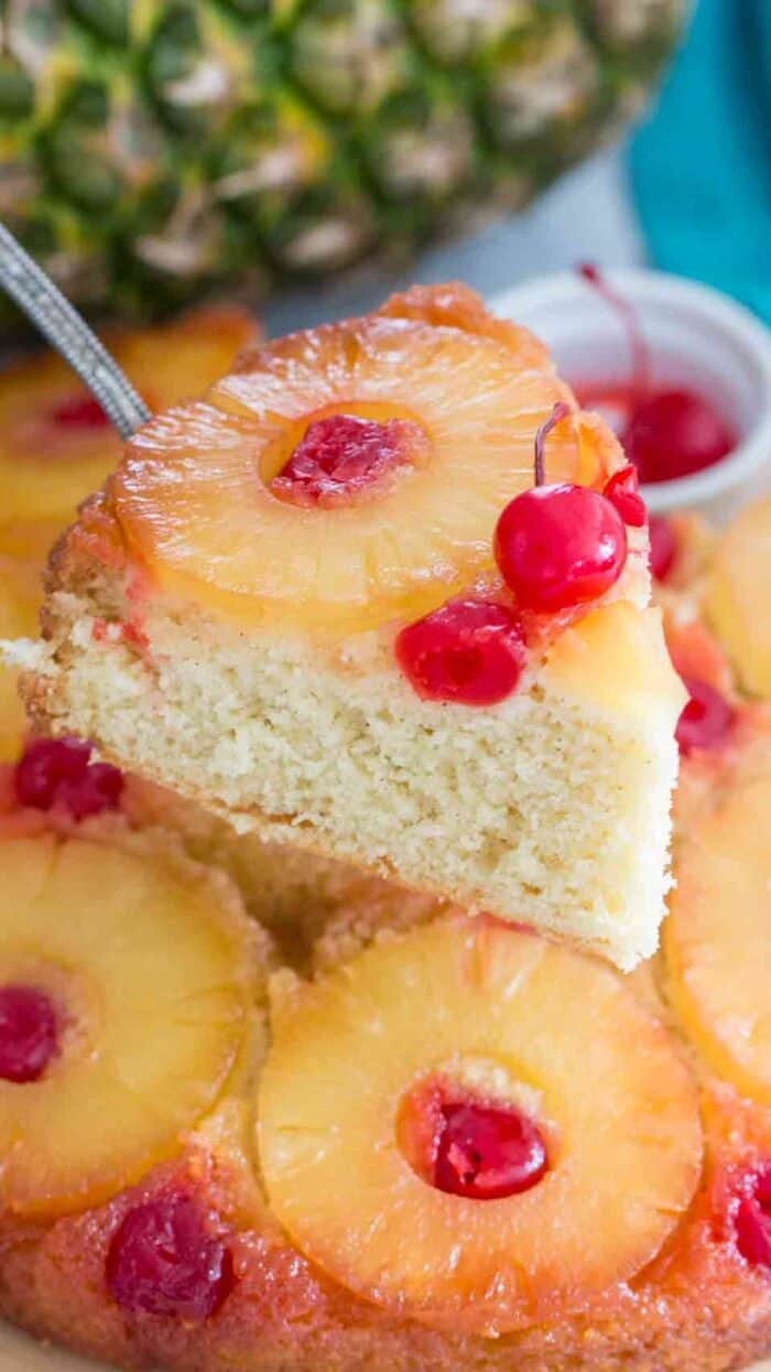 A piece of pineapple upside down cake on a pie server