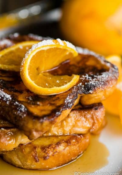 stack of french toast with orange