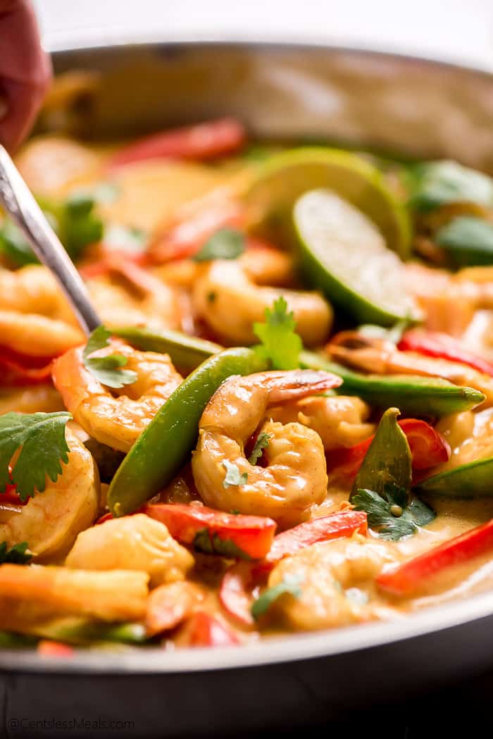 Shrimp curry in a pan garnished with cilantro