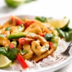 Shrimp Curry on a plate with rice and a fork