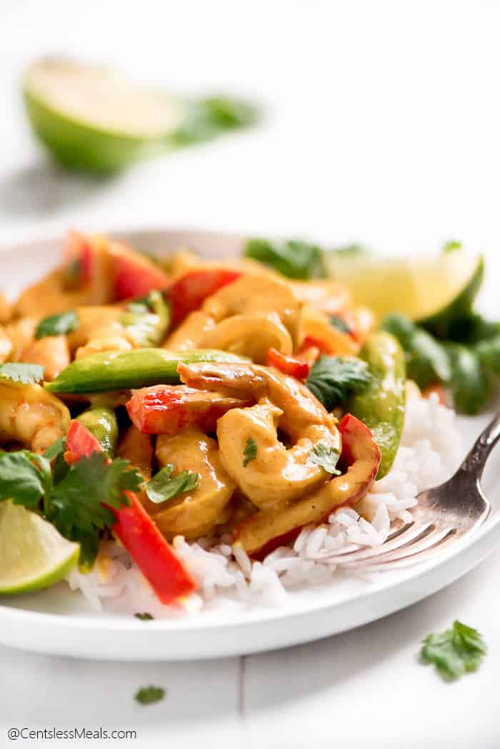 Shrimp Curry on a plate with rice and a fork