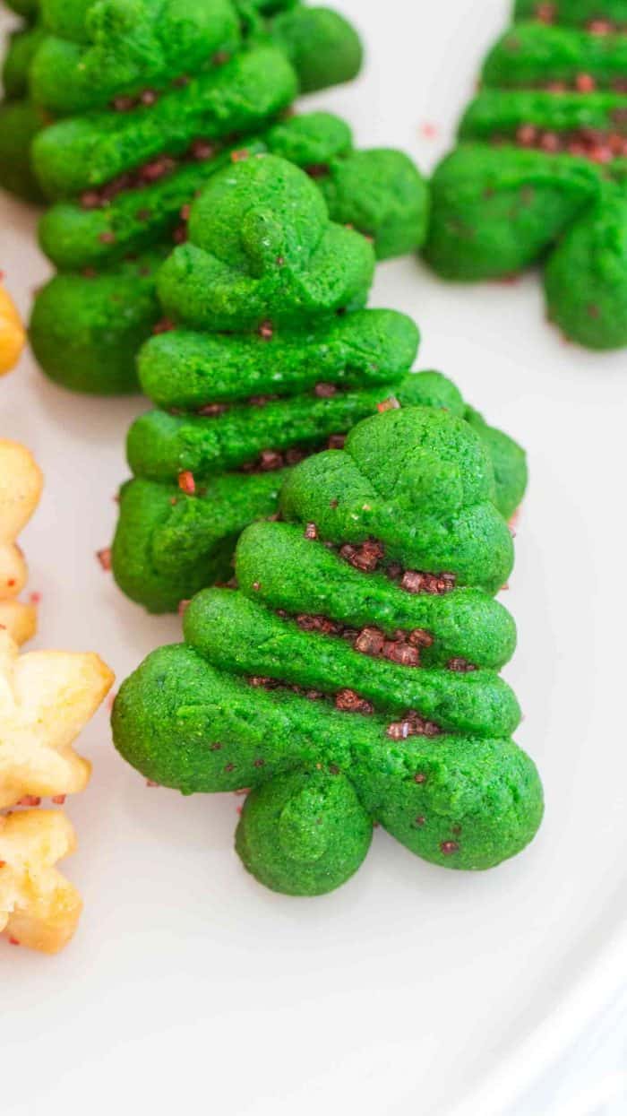 Green Christmas tree spritz cookies on a plate