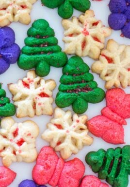 Spritz Cookies are fun to make, look festive, and taste delicious. They are perfect for the holiday season, and can be made in various colors and shapes.