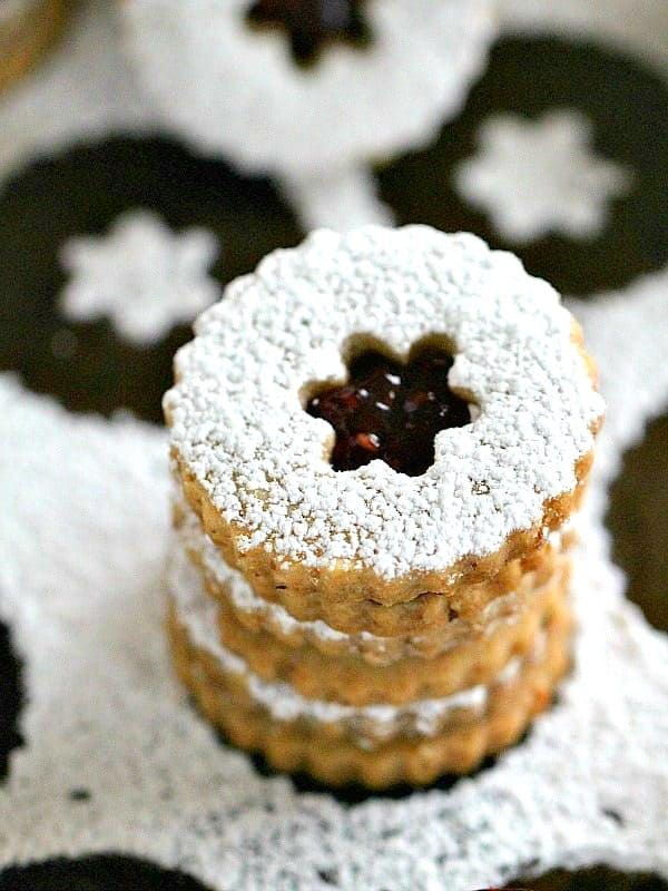 Walnut raspberry linzer cookies with powdered sugar