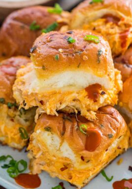 Buffalo Chicken Sliders made with rotisserie chicken, provolone cheese and buffalo sauce, are perfect for hosting an event, or to entertain a larger crowd.