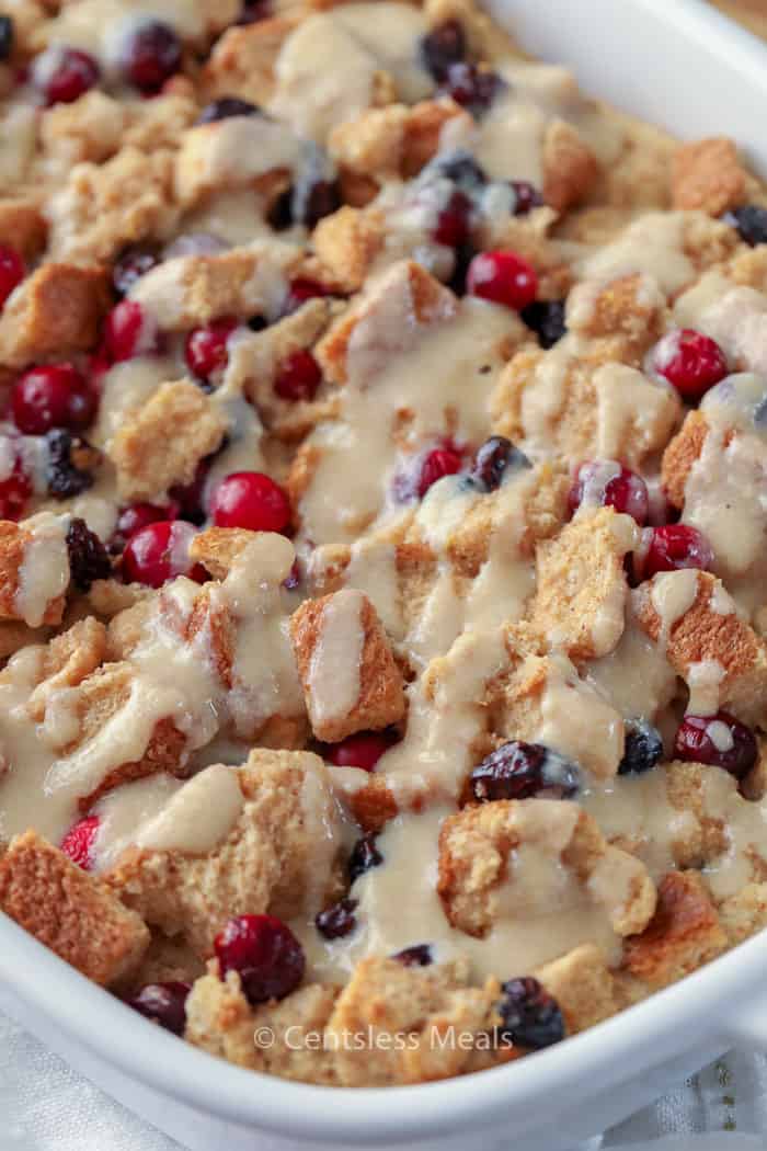 Cranberry bread pudding in a white casserole dish