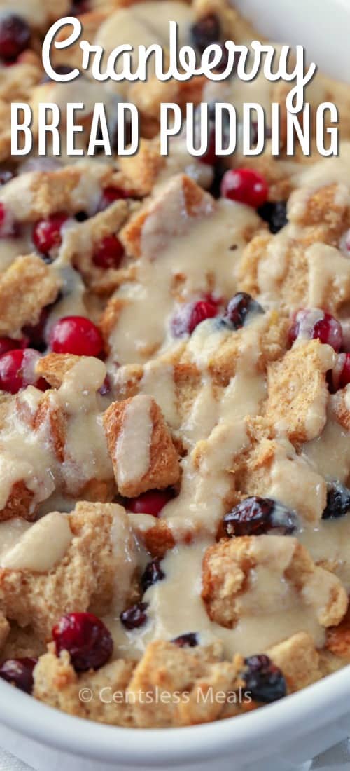 Cranberry bread pudding in a casserole dish with a title