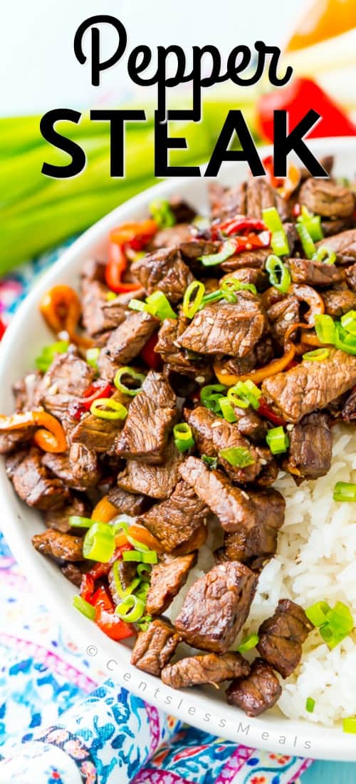 Pepper steak in a bowl with rice and a title