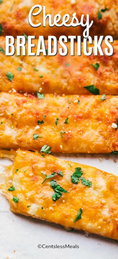 Cheesy breadsticks with parsley and writing