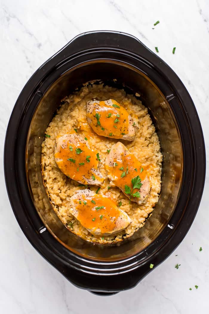 Chicken and rice in a Crock-Pot with cheese and parsley