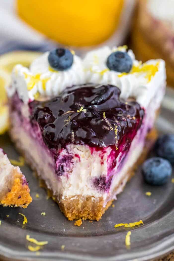 Blueberry Cheesecake Slice on a plate with a bite taken out