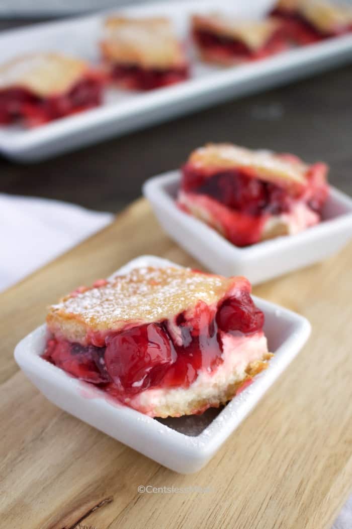 Cheesecake bake in white bowls on a wooden board