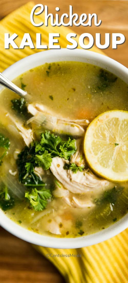 Chicken kale soup in a white bowl with writing