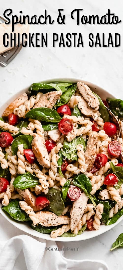 Chicken pasta salad in a white bowl with writing
