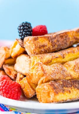 French Toast Sticks are a delicious breakfast treat many of us grew up with as kids made with bread, eggs, milk, almond extract, cinnamon, and sugar.