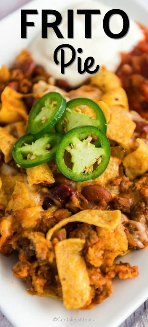 Frito pie on a plate with a title