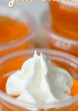 Creamsicle jello shots with whipped cream and a title