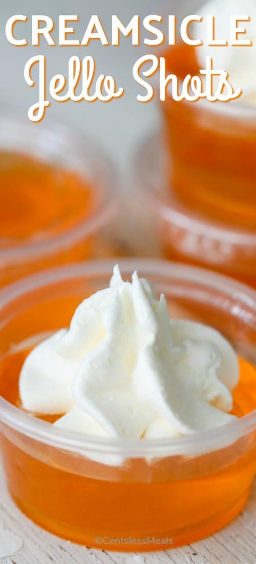 Creamsicle jello shots with whipped cream and a title