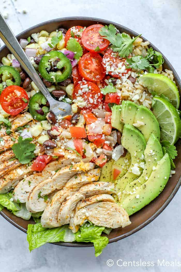 Chicken burrito bowl with a metal Fork