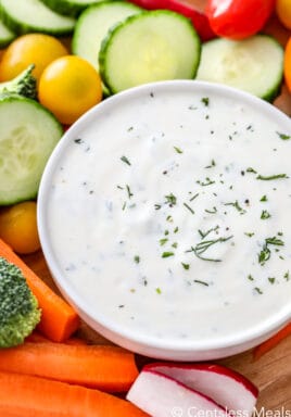 Easy veggie dip in a white bowl with veggies on the side