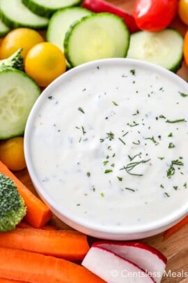 Easy veggie dip in a white bowl with veggies on the side