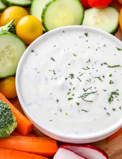 Easy veggie dip in a white bowl with veggies on the side