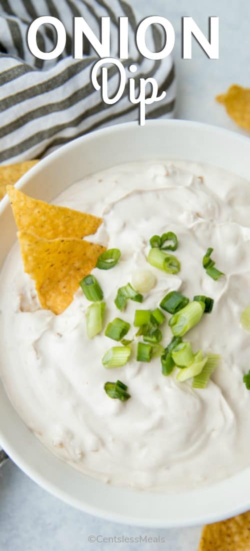 Onion dip in a bowl with green onions and a title