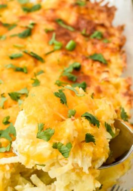 Cracker Barrel hashbrown casserole in a clear dish with writing