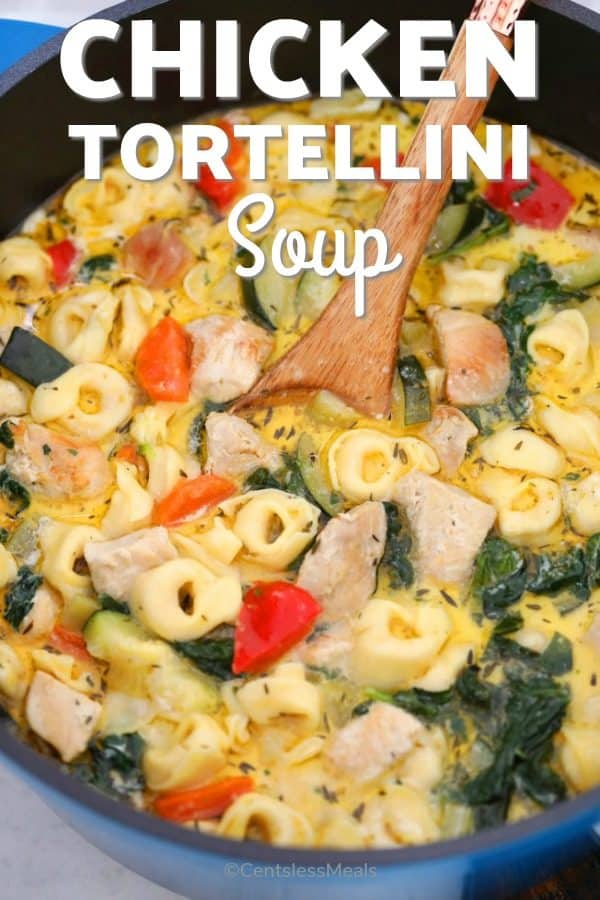 Chicken tortellini soup with a wooden spoon and a title