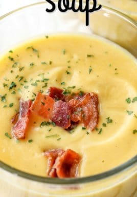 Squash Soup in a glass bowl with bacon garnish