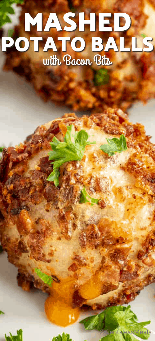 A close up of a mashed potato ball with cheese oozing out