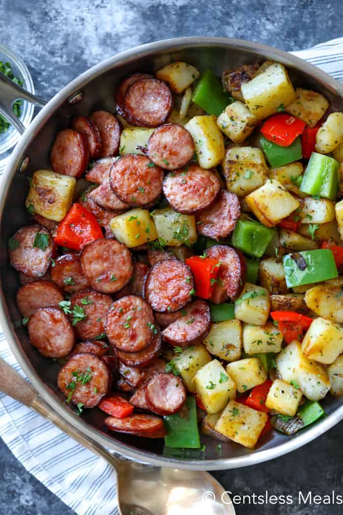 Sausage and potato Skillet in a pot with a spoon