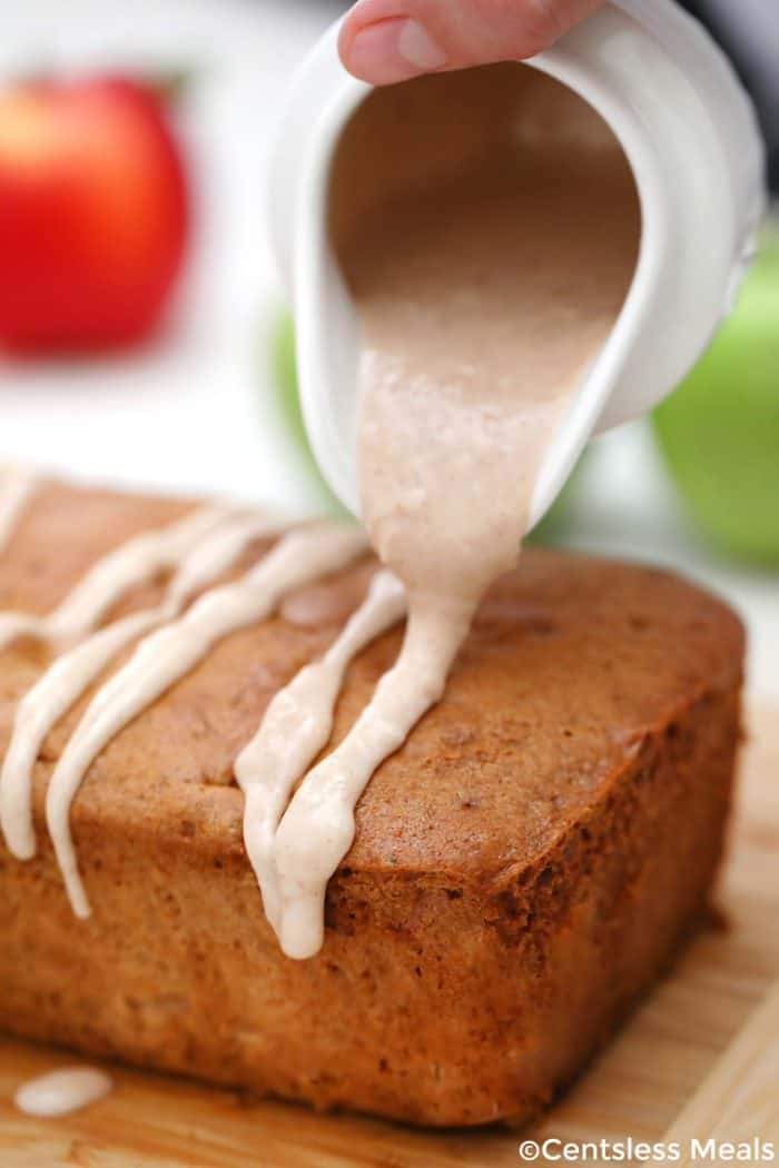 Cinnamon Apple Bread with sauce being poured on