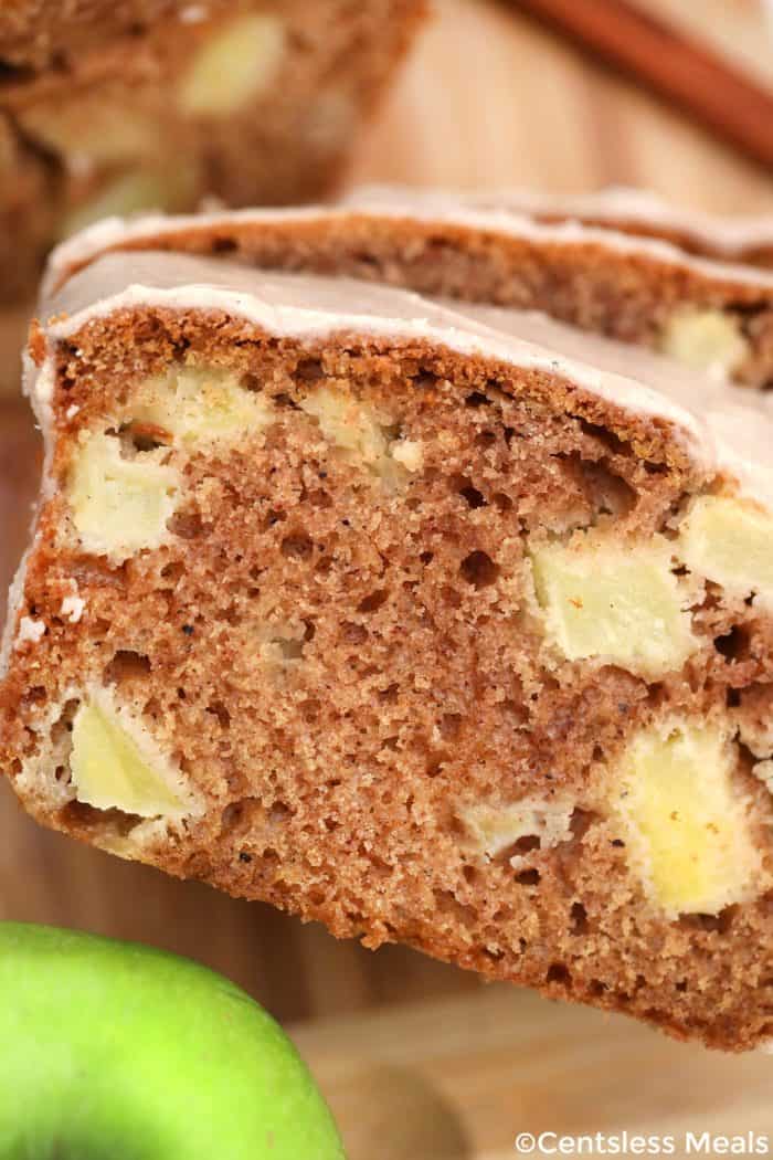 Cinnamon Apple Bread slices on a wooden board