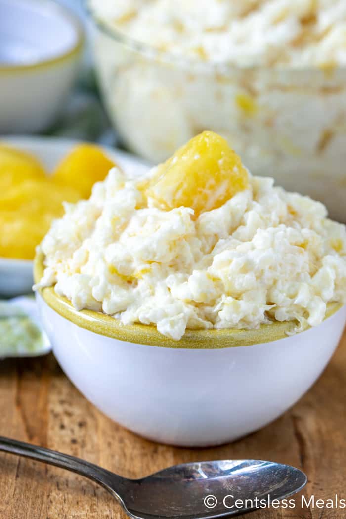 Pineapple rice pudding in a bowl with a spoon