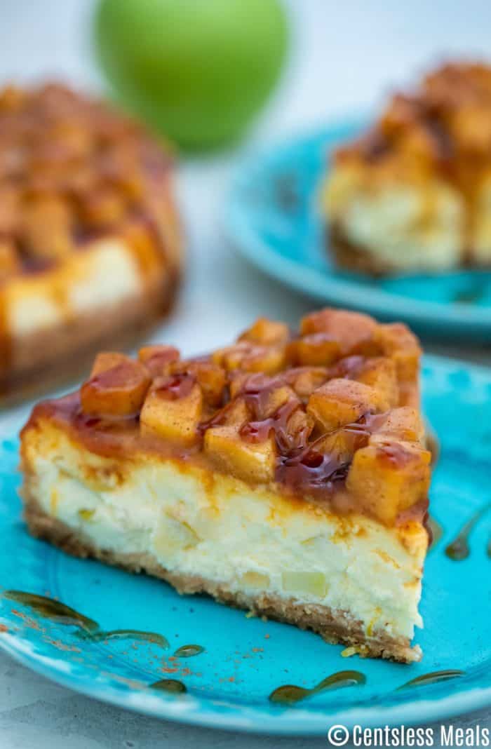 piece of Caramel Apple Cheesecake on a blue plate