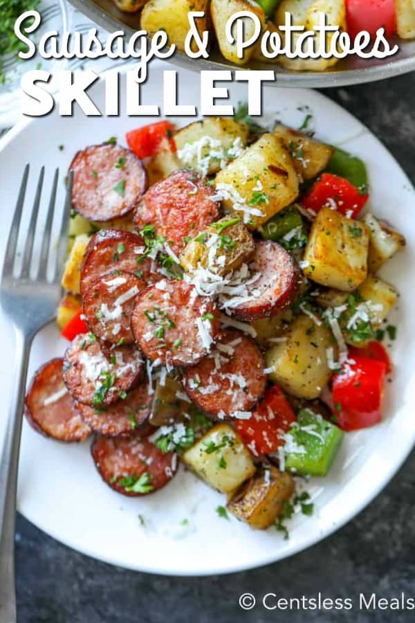 Sausage and potato Skillet on a white plate with a fork and a title