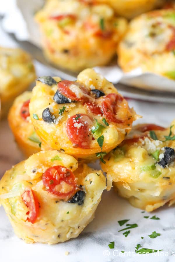 Pizza mac and cheese bites garnished with parsley