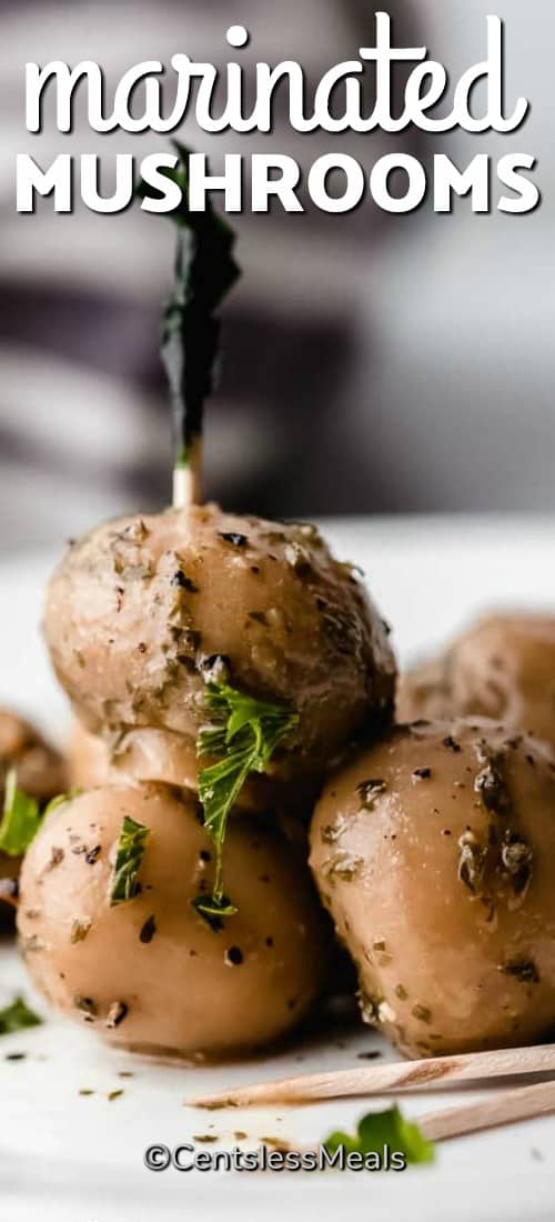 Marinated mushrooms on a plate with a title