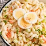 Macaroni salad with egg dropped with three slices of hard boiled egg