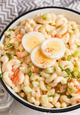 Macaroni salad with egg dropped with three slices of hard boiled egg
