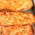 Cheesy bread on a baking sheet