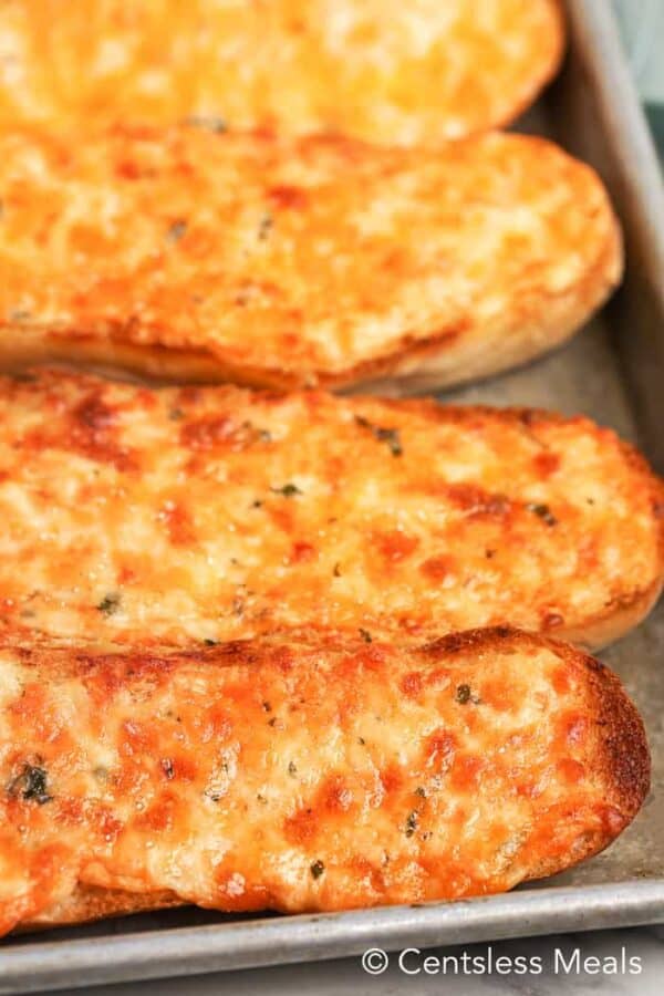 Cheesy bread on a baking sheet