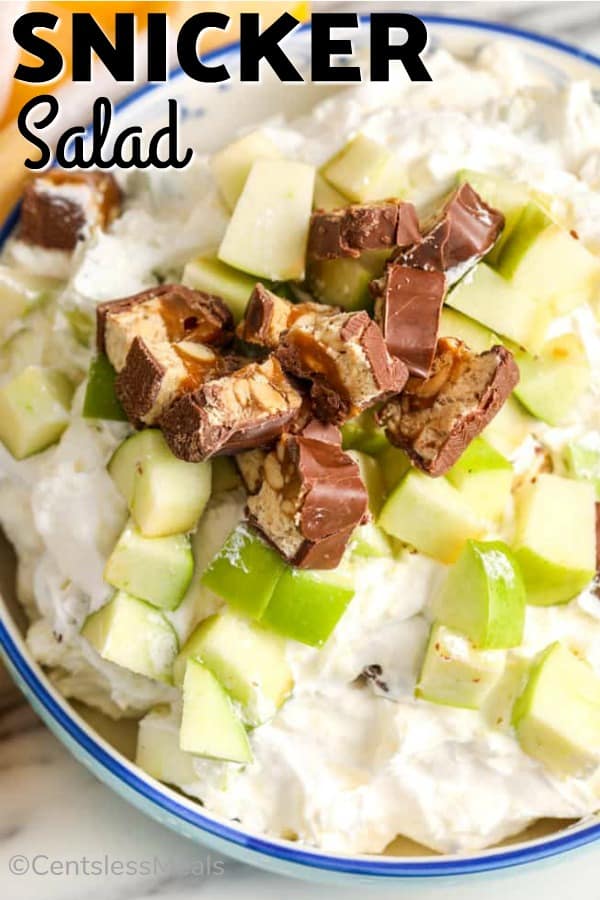 Snicker salad in a bowl with a title