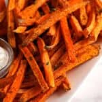 Sweet potato fries on a plate with aioli