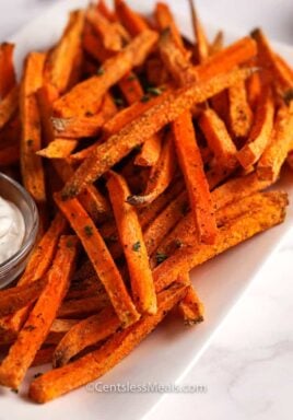 Sweet potato fries on a plate with aioli