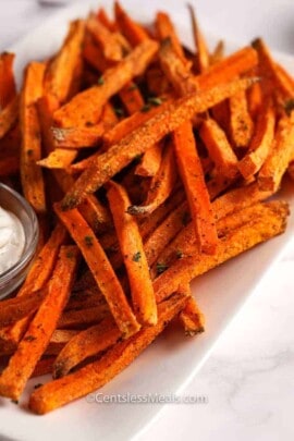 Sweet potato fries on a plate with aioli