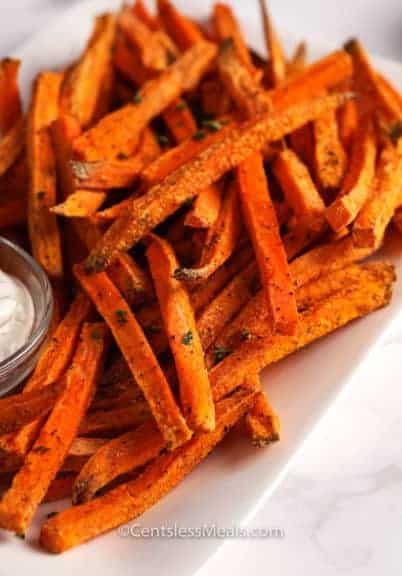 Sweet potato fries on a plate with aioli