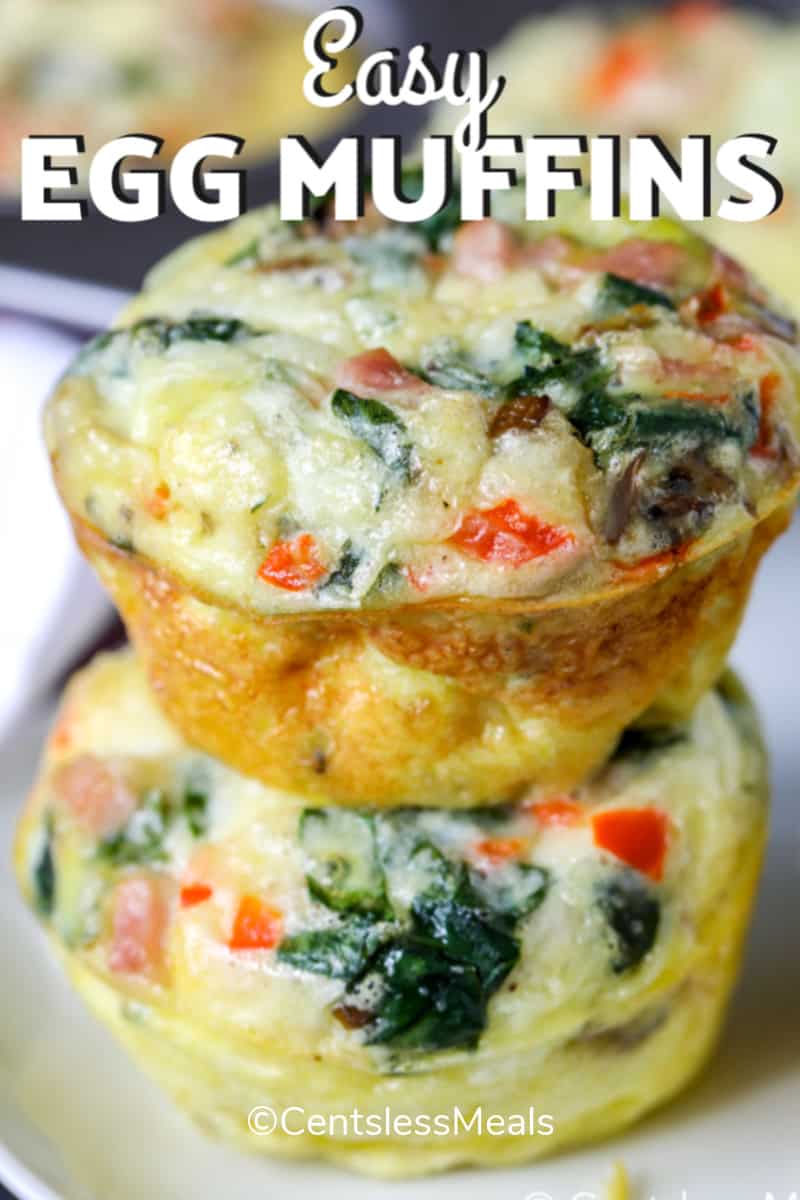 Two egg muffins stacked one on top of another, on a white plate.