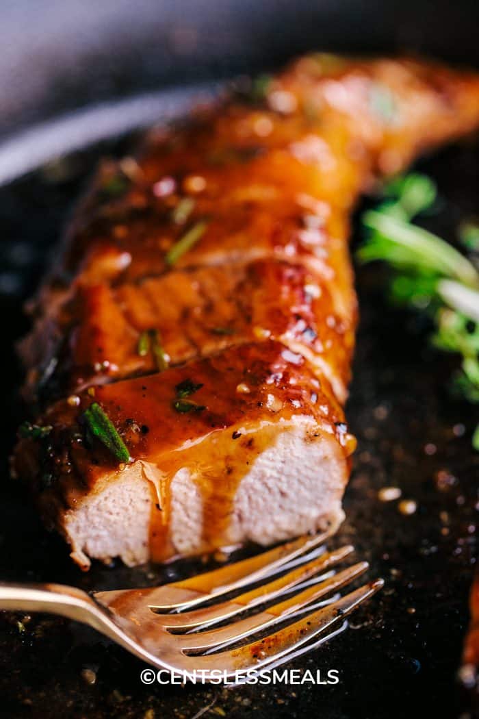 Honey Garlic Roasted Pork Tenderloin sliced in skillet